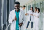 african-american-doctor-man-with-thumbs-up-standing-corridor-hospital