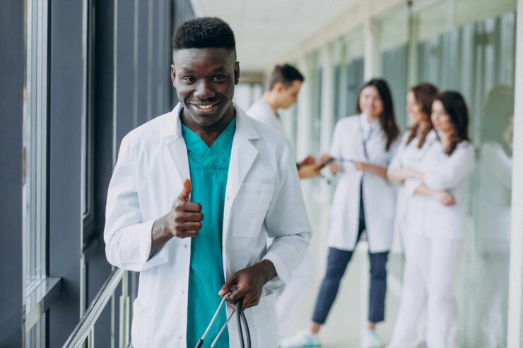 african-american-doctor-man-with-thumbs-up-standing-corridor-hospital